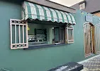 Meraki Coffee House green shopfront and serving hatch in Wetton